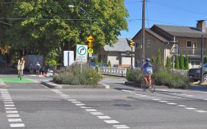 Cyclists on the crosstown Tenth Avenue bike route at Clark Drive, City of Vancouver