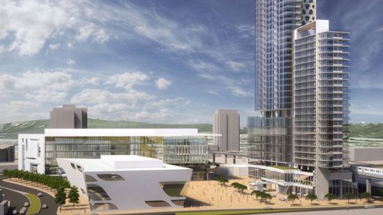 From a City of Surrey handout dated 2010. The new library is shown in the foreground, the City Hall behind; as-yet-unbuilt towers to the right, and a public square (busy, yet not crowded) in the middle.