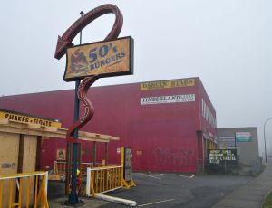 Edmonds Street just east of the Town Centre boundary: Drive-thru burger stand under renovation, dance studio, lumber wholesaler