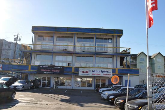Apartments over a used-car showroom, Hastings Street, at the western end of the East Village