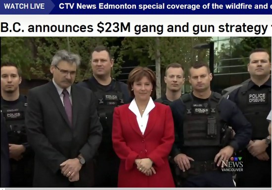 Premier Clark, centre, with B.C. Public Safety Minister Mike Morris and Surrey police
